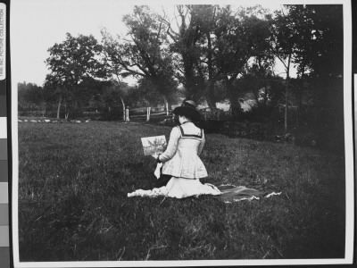 Rear View Of Leticia Brady Working On A Small Painting Of A Wooden Bridge Over A Stream by Wallace G. Levison Pricing Limited Edition Print image