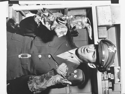 Uniformed Actor And Pilot, Colonel Jimmy Stewart Holding Rough Wooden-Headed Hand Puppets by Peter Stackpole Pricing Limited Edition Print image