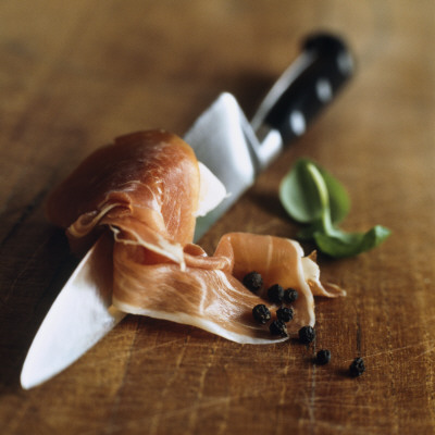 A Knife And A Thin Slice Of Meat Along With Some Pepper Corns by Niclas Albinsson Pricing Limited Edition Print image