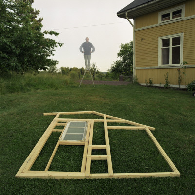 Mould Of A House And A Man Standing In Stepladder by Mikael Andersson Pricing Limited Edition Print image