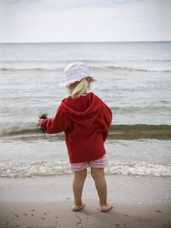 Rear View Of A Girl Standing On The Beach by Gunilla Lundstrom Pricing Limited Edition Print image