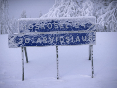 Road Signs In Snow, Sweden by Lars Dahlstrom Pricing Limited Edition Print image