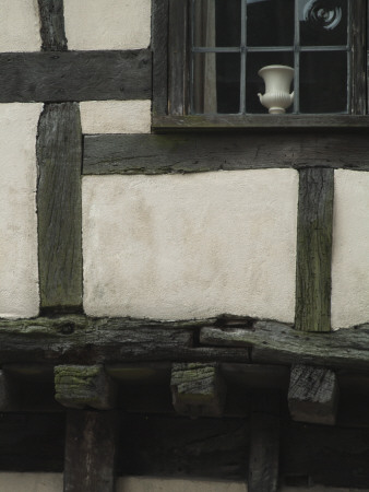 Detail Of Half-Timbered House Showing Timbers, Rendering And Bullseye Glass Window Pane by Natalie Tepper Pricing Limited Edition Print image