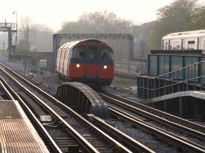 Piccadilly Line Train Approaching Turnham Green Underground Station, London by Natalie Tepper Pricing Limited Edition Print image