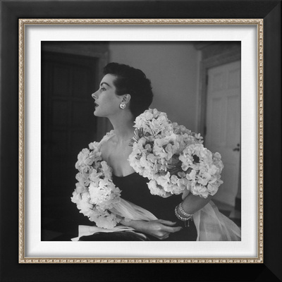 Model Wearing A Flowery Dress While Peering Into The Distance by Nina Leen Pricing Limited Edition Print image
