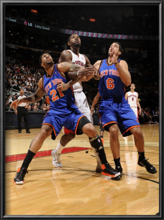 New York Knicks V Toronto Raptors: Amir Johnson, Wilson Chandler And Landry Fields by Ron Turenne Pricing Limited Edition Print image