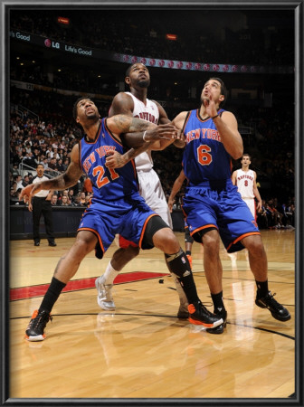 New York Knicks V Toronto Raptors: Amir Johnson, Wilson Chandler And Landry Fields by Ron Turenne Pricing Limited Edition Print image