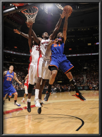 New York Knicks V Toronto Raptors: Wilson Chandler And Amir Johnson by Ron Turenne Pricing Limited Edition Print image