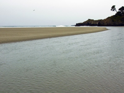 River Flows Into The Ocean Along A Empty Beach With Surf Beyond by Stephen Sharnoff Pricing Limited Edition Print image