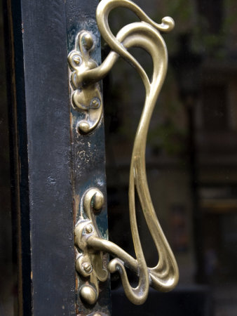 Close-Up Of An Art Nouveau Brass Door Handle In Barcelona by Stephen Sharnoff Pricing Limited Edition Print image
