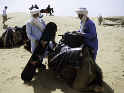 Packing Up A Camel, Morocco by Michael Brown Pricing Limited Edition Print image