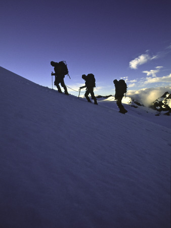 Climbers Silhouetted In Morning Sun, New Zealand by Michael Brown Pricing Limited Edition Print image