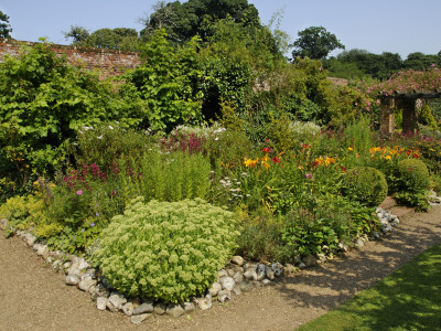 Large Garden Border Planted With Perennials And Shrubs, Gunthorpe Hall, Norfolk, Uk by Gary Smith Pricing Limited Edition Print image