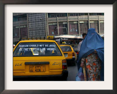 An Afghan Woman Clad In A Burqa Walks Next To A Taxi In Kabul, Afghanistan, Wednesday, June 7, 2006 by Rodrigo Abd Pricing Limited Edition Print image