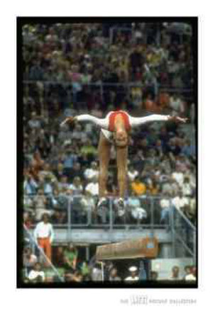 Lifer - Olga Korbut On Balance Beam During Summer Olympics, 1972 by John Dominis Pricing Limited Edition Print image