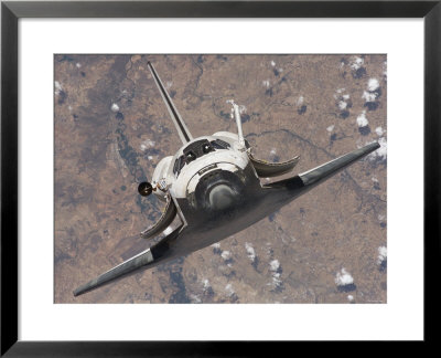 The Space Shuttle Discovery Approaches The International Space Station For Docking by Stocktrek Images Pricing Limited Edition Print image