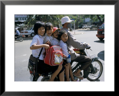 Children Riding On A Motor Scooter, Phnom Penh, Cambodia, Indochina, Southeast Asia by Bruno Morandi Pricing Limited Edition Print image