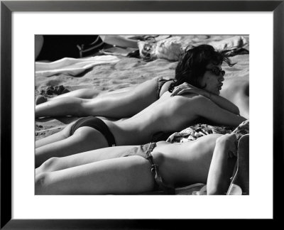 Bikini Clad Beauties On The Beach At The Cannes Film Festival by Paul Schutzer Pricing Limited Edition Print image