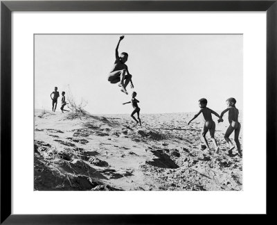 Bushman Children Playing Games On Sand Dunes by Nat Farbman Pricing Limited Edition Print image