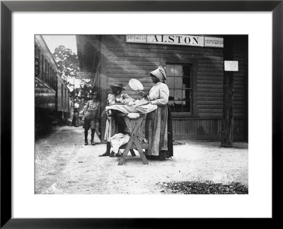 Two Young Black Women Selling Cakes At Alston Railroad Station, Next To A Train That Has Stopped by Wallace G. Levison Pricing Limited Edition Print image
