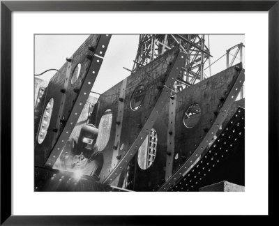 Welder Securing Steel Structure While Working On Hull Of A Ship, Bethlehem Shipbuilding Drydock by Margaret Bourke-White Pricing Limited Edition Print image