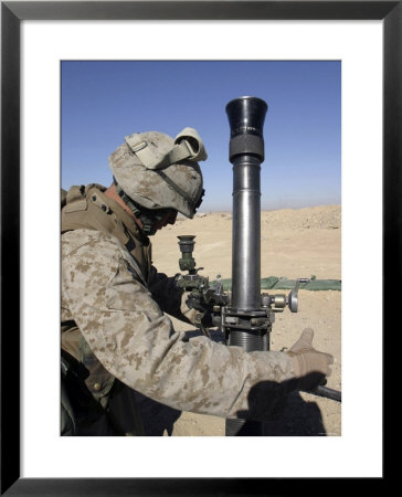 An 81Mm Mortarman Adjusts The Mortar Sights During A Fire Mission by Stocktrek Images Pricing Limited Edition Print image