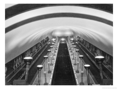 Escalators In A Tube Station by Maynard Owen Williams Pricing Limited Edition Print image