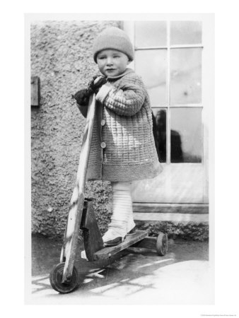 Small Boy On His Home-Made Scooter by Staniland Pugh Pricing Limited Edition Print image