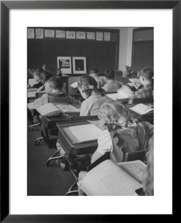 Typical 10 Year Old Girls Known As  Pigtailers Sitting In Classroom by Frank Scherschel Pricing Limited Edition Print image