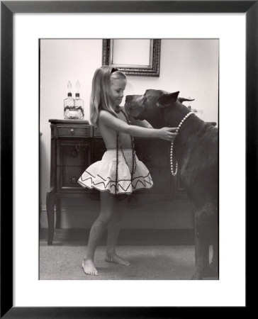 Model Posed Putting Costume Jewelry On Great Dane, Children's Fall Fashion by Nina Leen Pricing Limited Edition Print image