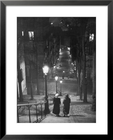 Pair Of Prostitutes Descending Stairs After Dark In Montmartre by Alfred Eisenstaedt Pricing Limited Edition Print image
