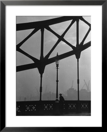 London Bobby In His Wartime Tin Helmet Patrolling The Tower Bridge by Carl Mydans Pricing Limited Edition Print image