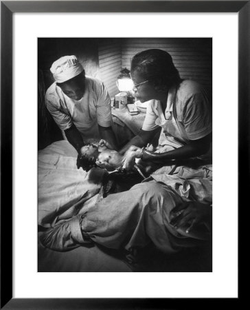 African American Midwife Maude Callen Delivering A Baby by W. Eugene Smith Pricing Limited Edition Print image