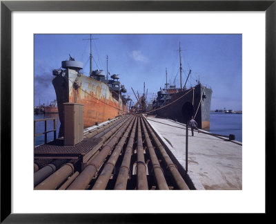 Pipeline Running To Loading Pier At Oil Refinery by Dmitri Kessel Pricing Limited Edition Print image