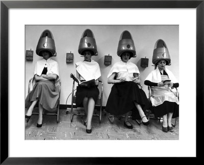 Women Sitting And Reading Under Hairdryers At Rockefeller Center Pamper Club by Nina Leen Pricing Limited Edition Print image