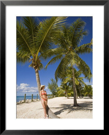 Woman Leaning Against Palm Tree, Princess Cays, Eleuthera Island, West Indies, Caribbean by Richard Cummins Pricing Limited Edition Print image