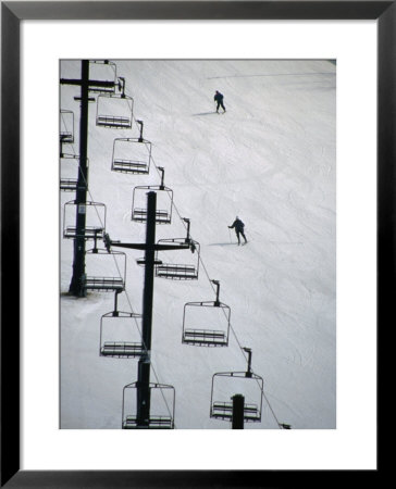 Skiers Coming Down Slope Below Chairlifts At Bittersweet Ski Resort, Otsego, Usa by Charles Cook Pricing Limited Edition Print image