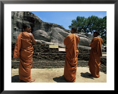 Three Monks In Front Of A Statue Of The Buddha, Gal Vihara, Polonnaruwa, Sri Lanka by Yadid Levy Pricing Limited Edition Print image
