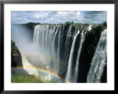 Waterfalls And Rainbows, Victoria Falls, Unesco World Heritage Site, Zambia, Africa by D H Webster Pricing Limited Edition Print image