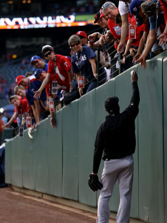 Texas Rangers V. San Francisco Giants, Game 5:  A Player From The San Francisco Giants Hands A Ball by Doug Pensinger Pricing Limited Edition Print image