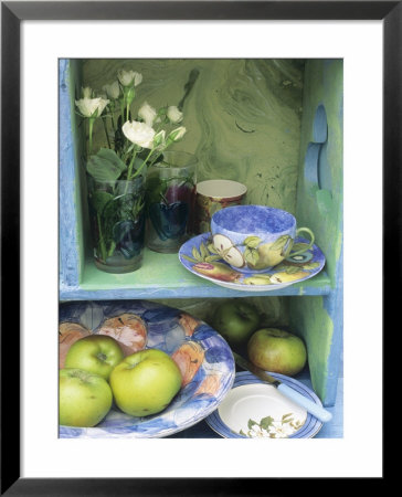 Coffee Cup, Flowers And Bowl Of Apples On Shelves by Linda Burgess Pricing Limited Edition Print image