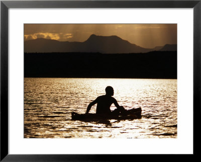 Njemp Fisherman Paddling On Lake At Sunset, Lake Baringo, Kenya by Anders Blomqvist Pricing Limited Edition Print image