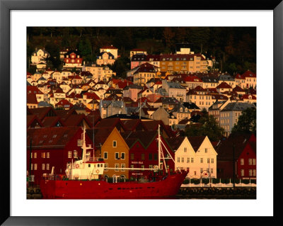 Fishing Vessel Moored In Front Of Wooden Buildings On The Bryggen Waterfront, Bergen, Norway by Anders Blomqvist Pricing Limited Edition Print image