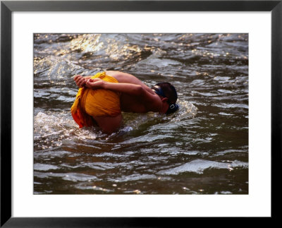 Novice Monk In River, Xieng Kok, Luang Nam Tha, Laos by Anders Blomqvist Pricing Limited Edition Print image
