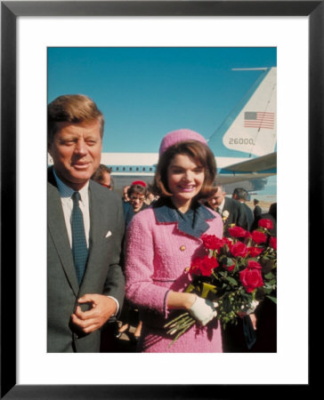 President John F. Kennedy Standing With Wife Jackie After Their Arrival At The Airport by Art Rickerby Pricing Limited Edition Print image