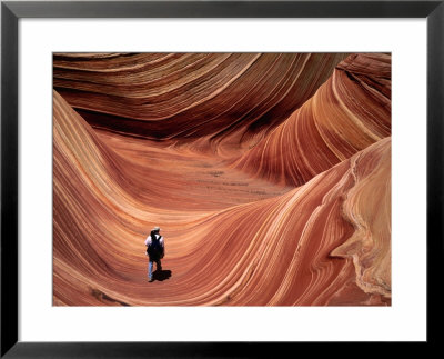 Man Walking Through The Wave Formation, Vermillion Cliffs National Monument by Mark Newman Pricing Limited Edition Print image