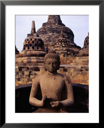 Statue In Buddhist Complex, Borobudur, Indonesia by Juliet Coombe Pricing Limited Edition Print image