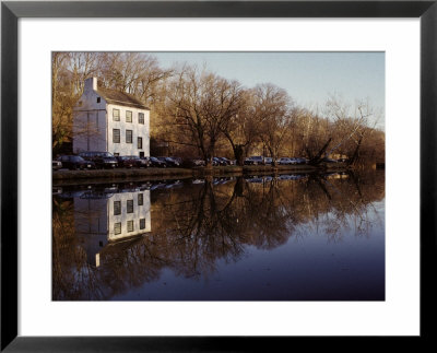 An Old Lockhouse Reflected In The C & O Canal by Stephen St. John Pricing Limited Edition Print image
