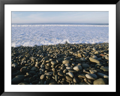 Whitewater From Crashing Waves Washes Onto A Pebble Beach by Rich Reid Pricing Limited Edition Print image