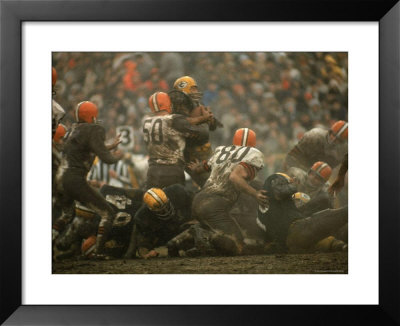 Cleveland Browns Vince Costello Wrapping A Tackle Around Green Bay Packers Running Back Jim Taylor by Art Rickerby Pricing Limited Edition Print image